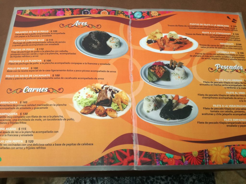 Image of a menu at a San Cristobal restaurant called El Sazon Que Me Toquen, shwoing cheap prices, lower cost of living in Mexico.