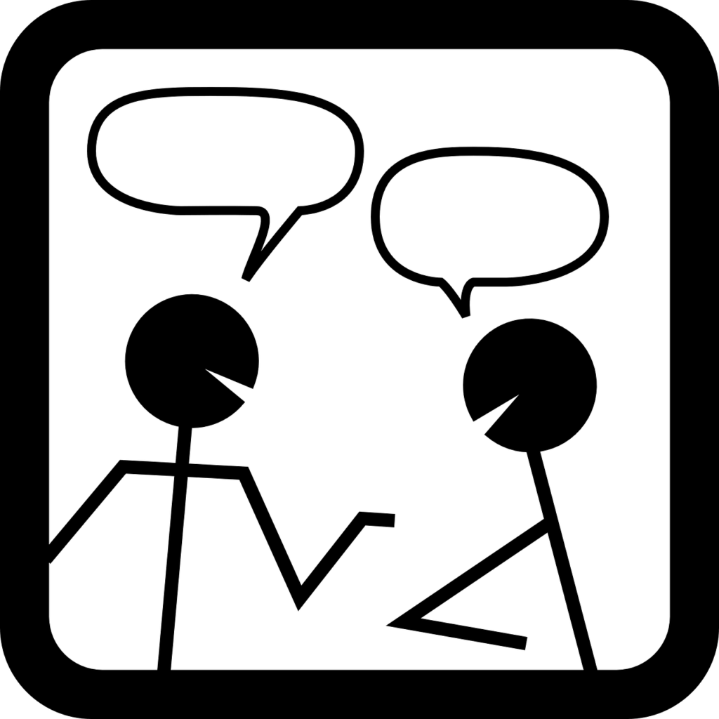 Two stick figures conversing. Begin speaking with Spanish speakers to develop Spanish fluency.